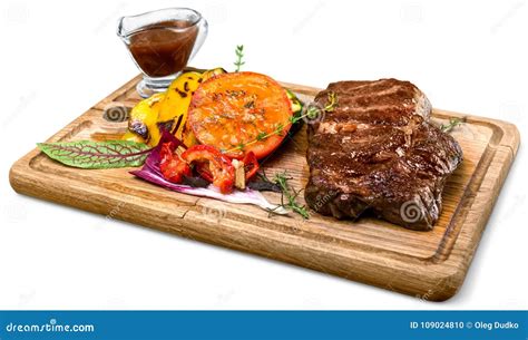 A Big Grilled Steak On A Wooden Plate Top View Stock Photo Image Of