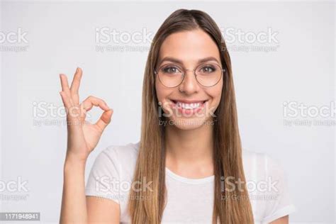 Closeup Photo Of Pretty Lady Showing Okey Symbol Wear Specs And Tshirt