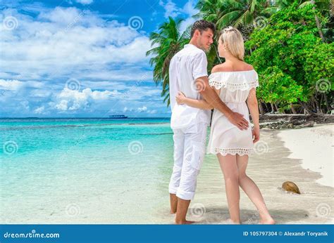 Two Lovers, Hugging Each Other Strolling Along the Maldivian Isl Stock ...