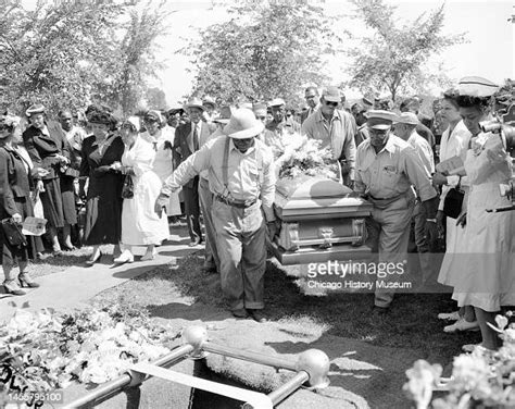 People carrying Emmett Till's casket to his gravesite during a burial ...