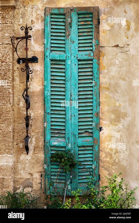 Worn Wooden Window Shutters On The Shabby Orange Wall Stock Photo Alamy