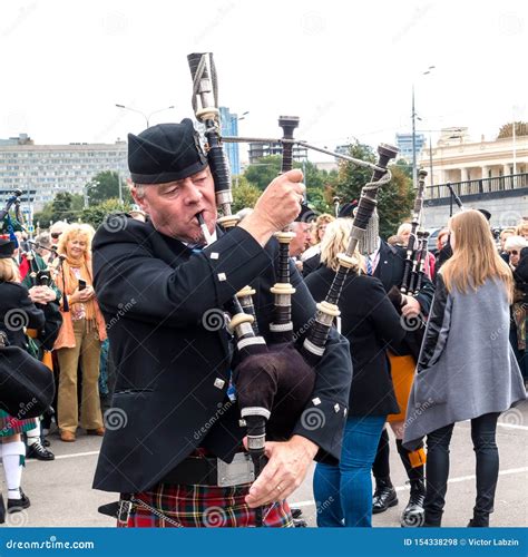 Scottish Piper Playing The Traditional Bagpipe Editorial Stock Photo