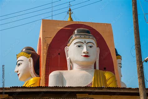 Four statues of sitting Buddhas. Pagoda Kyaikpun Buddha. Bago, Myanmar ...