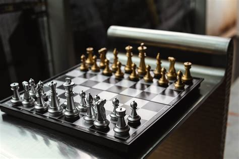 A Chess Board with Silver and Gold Pieces · Free Stock Photo