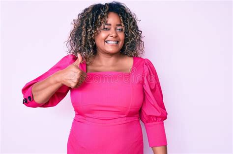 Young African American Plus Size Woman Wearing Casual Clothes Smiling