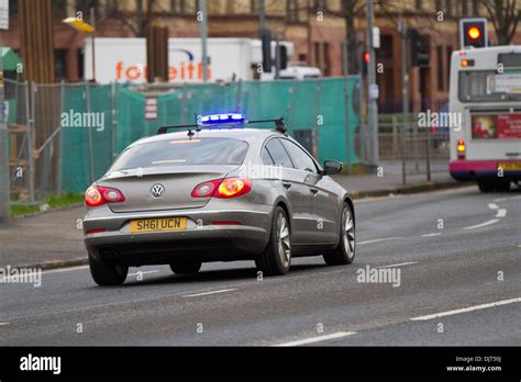 Unmarked Police car Strathclyde police UK speeding to a scene with blue ...