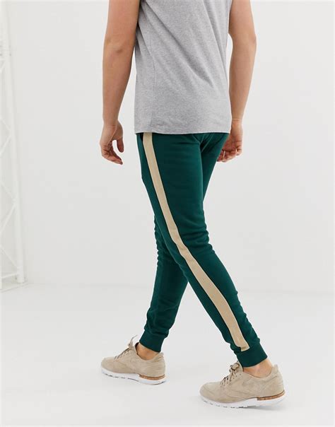 Asos Design Super Skinny Sweatpants With Side Stripe In Dark Green