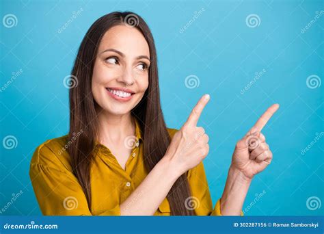 Photo Of Dreamy Positive Lady Wear Yellow Shirt Looking Pointing Two Fingers Empty Space