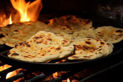 naan bread  tandoor oven photo premium ai generated image