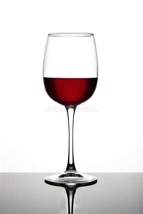 Wine Glasses of Different Shapes with Multi-colored Drinks on a White ...