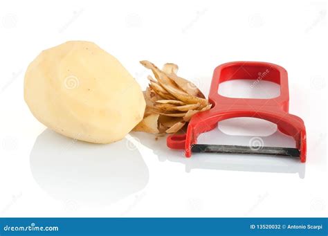 Potato peeler with potato stock photo. Image of fresh - 13520032