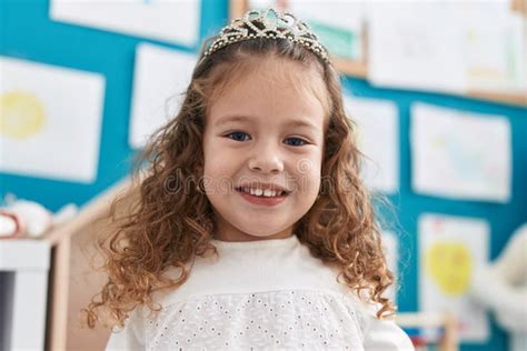 Adorable Blonde Toddler Smiling Confident Wearing Princess Crown At