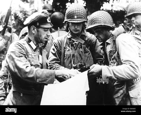 German Officer A Georgian Explaining Details Of A Military Map To Us Officers From The Allied