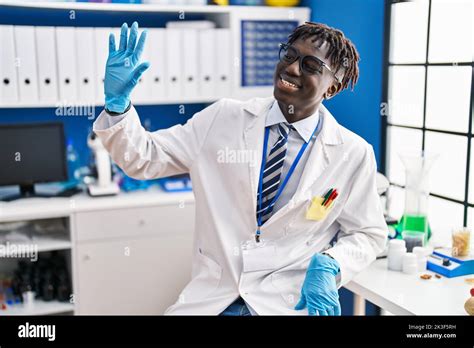 African American Man Scientist Smiling Confident Speaking At Laboratory