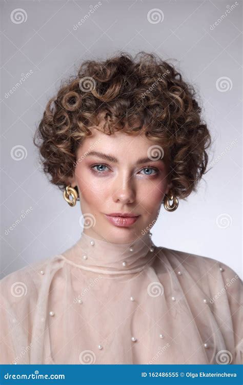 Vintage Style Portrait Of Beautiful Woman With Curly Hair And Natural