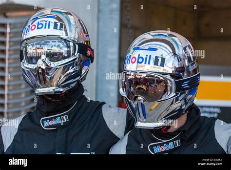 Pit crew in chrome effect helmets at the Le Mans 24hr endurance race ...