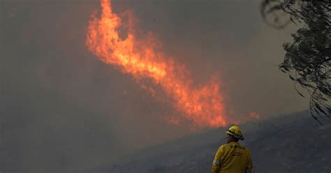 Mandatory evacuations ordered as brush fire closes freeway in California