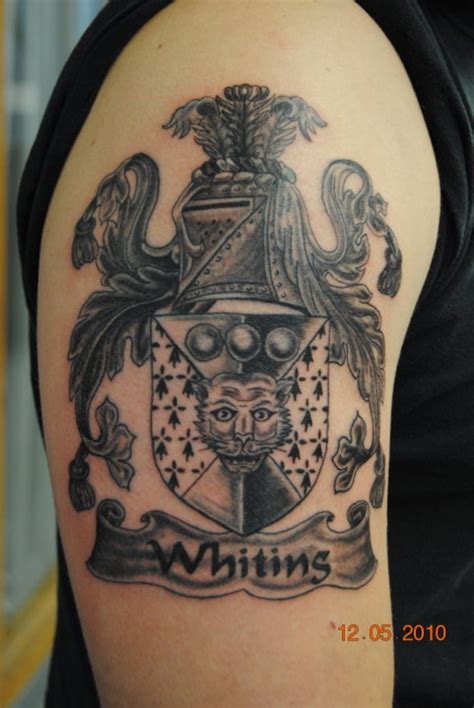 Beautiful gray ink family crest tattoo on half sleeve - Tattooimages.biz