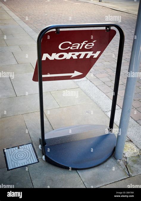 Cafe North Sign On Pavement In Northern Quarter Manchester Uk Stock