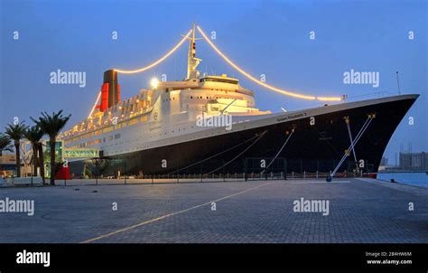 Illuminated hotel and museum ship Queen Elizabeth 2 (QE2) at the pier ...