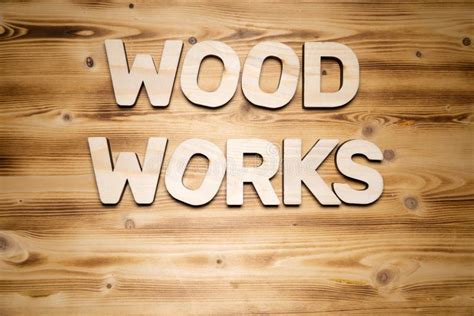 WOODWORK Word Made With Building Blocks On Wooden Board Stock Photo