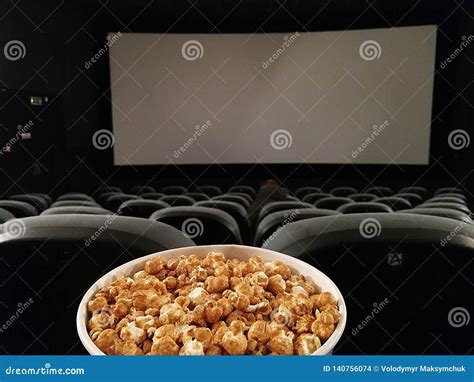 Cinema Seat and Pop Corn Facing Empty Movie Screen Stock Photo - Image ...