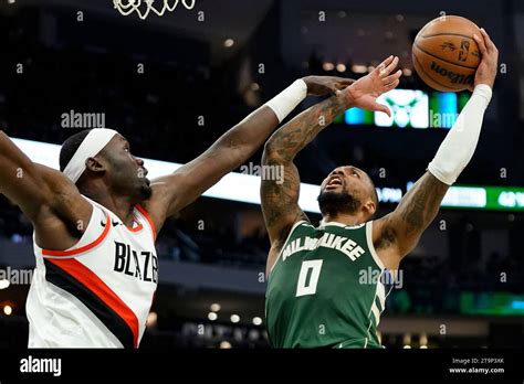 Milwaukee Bucks Damian Lillard Is Fouled As He Shoots Against