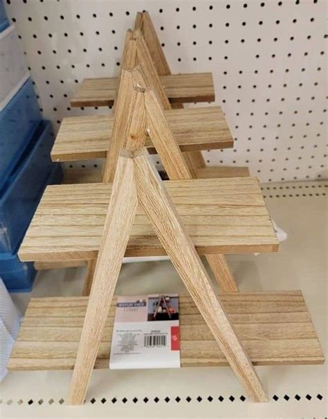 Three Wooden Shelves Stacked On Top Of Each Other