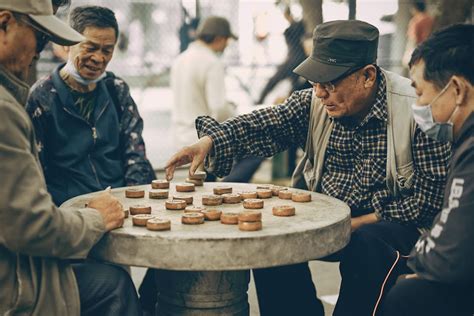 Group of Elderly Men Playing Board Game - Stock Image - Everypixel