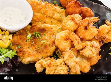 Fried Seafood Platter With Fish Shrimp Oysters Hush Puppies And A