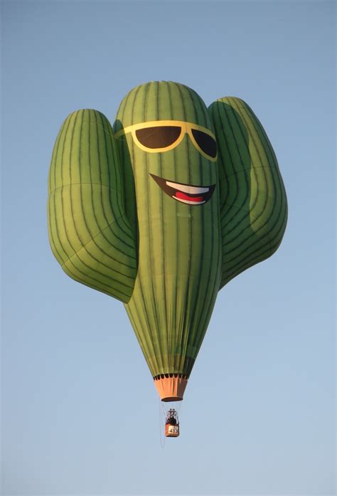 A Green Hot Air Balloon With Sunglasses On It