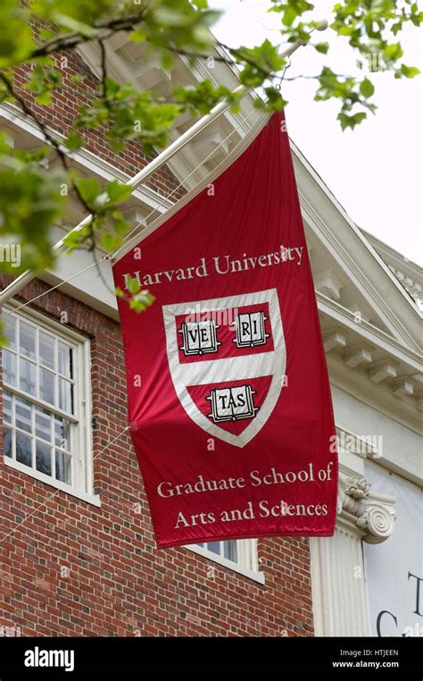 Harvard University flag - flying on campus Stock Photo - Alamy