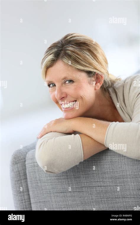 Beautiful 40 Year Old Woman Relaxing In Sofa Stock Photo Alamy