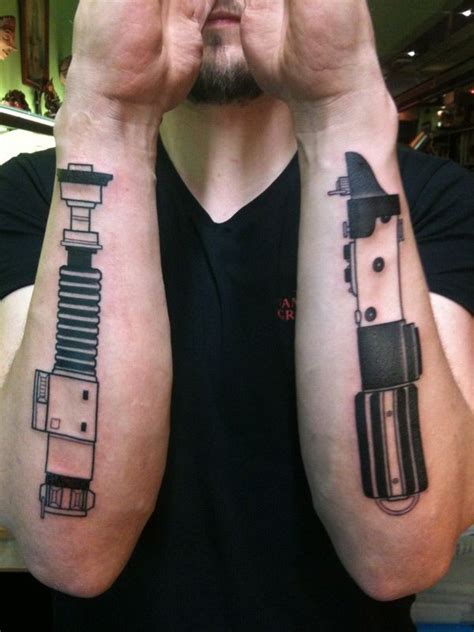 Dueling Lightsabers Lightsaber Tattoo Arm Tattoos For Guys