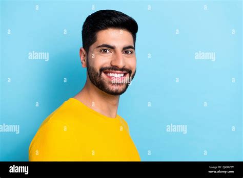 Photo Of Funky Cool Man Wear Yellow Sweater Smiling Empty Space Isolated Blue Color Background