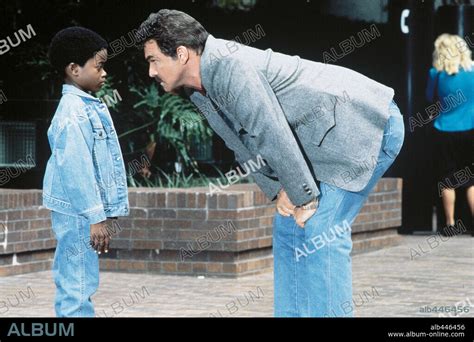 BURT REYNOLDS and NORMAN D. GOLDEN II in COP AND A HALF, 1993, directed by HENRY WINKLER ...