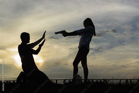 Silhouette Woman Pointing A Gun Mafia Girl Shooting At Someone Stock