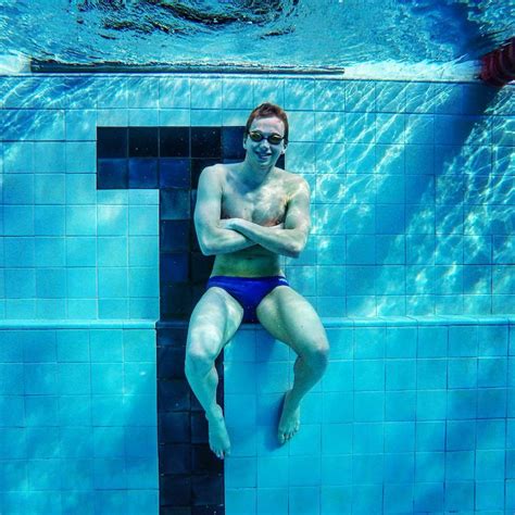 Underwater Men Breatholding Underwater In Tight Speedo