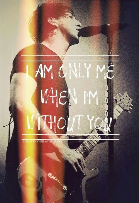 A Man Holding A Guitar In Front Of A Microphone With The Words I Am Only Me When Im Without You