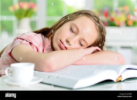 Girl Sleeping On Books Stock Photo Alamy