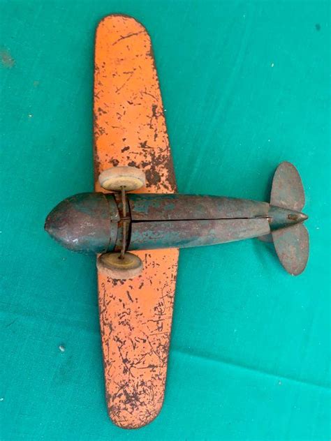 LOT 73 ANTIQUE METAL TOY AIRPLANE RUBBER WHEELS AS IS | EstateSales.org