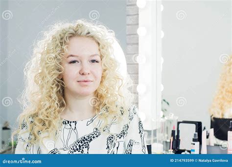 The Beautiful Blonde Admires Her Hair In A Beauty Salon Stock Image