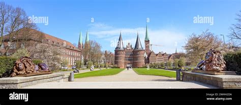 Wide Panorama Of The Lubeck Holstentor Or Holsten Gate Park With Two