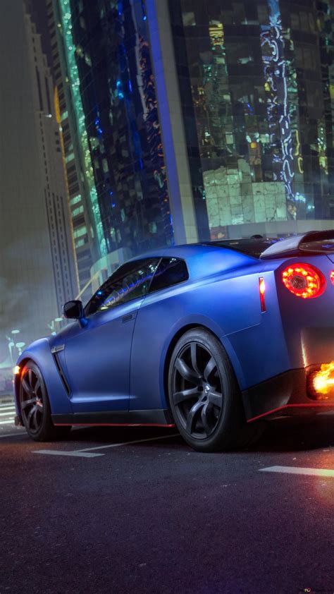 Back view of blue Nissan GTR in night city 4K wallpaper download