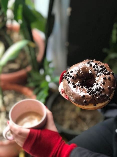 Premium Photo Cropped Hand Of Person Holding Food