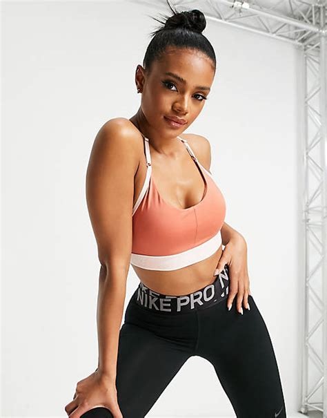 Nike Training Indy Dri Fit Logo Band Light Support Sports Bra In Rose Pink Asos