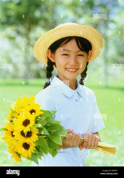 Girl with Sunflowers Stock Photo - Alamy