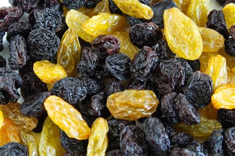 Premium Photo A Mixture Of White And Dark Raisins Dried Grapes Of