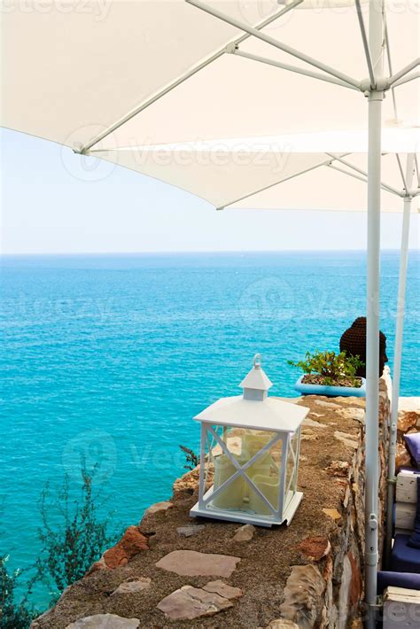 Restaurant with summer terrace and sea views. Vertical image. 12381286 Stock Photo at Vecteezy