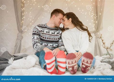 Young Lovely Couple Beautiful Wife And Handsome Husband Both Wearing Warm Sweaters And Festive